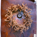 <p>George Herms<br /> Wreath <br />2002<br /> Wall assemblage<br />46" x 38" x 11"</p>